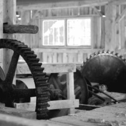 A black and white photo of a machine in a building