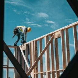 construction worker in hard hat on building frame